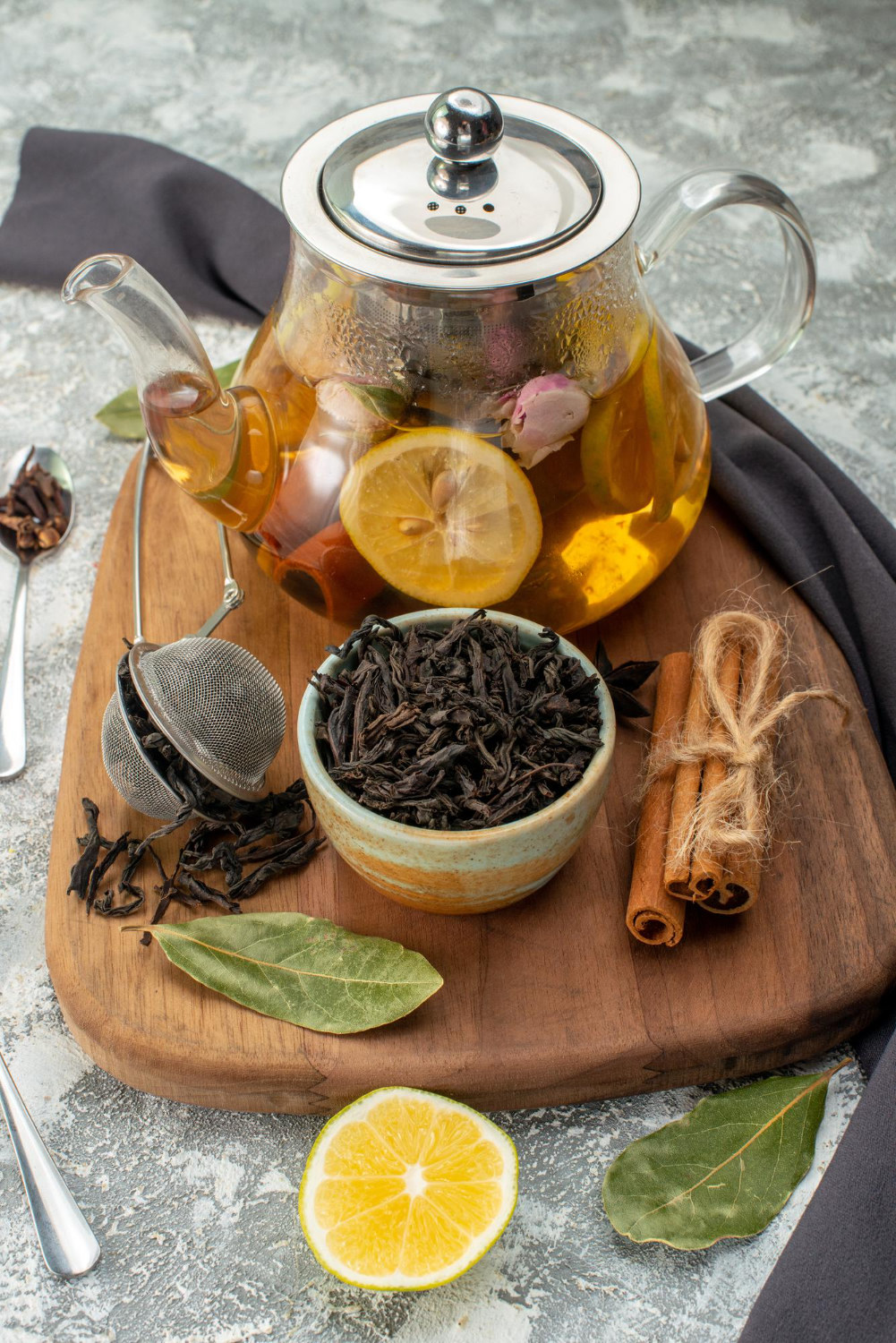 Herbal tea with lemon, cinnamon, and loose leaves
